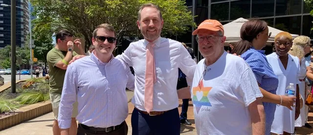 ASJR core member smiling outdoors.