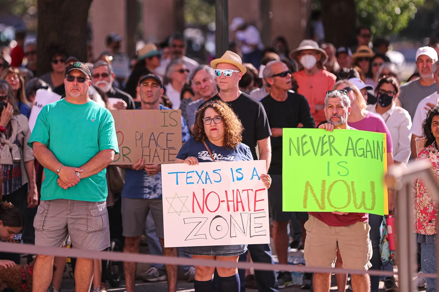 A group of protesters holding signs for social justice reform